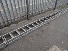 A long set of double extending aluminum ladders