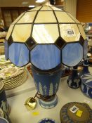 A blue Wedgwood Jasperware table lamp base with Tiffany-style shade