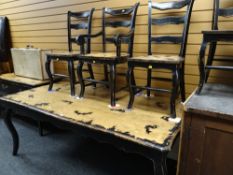 A modern French country-style part painted black dining table together with six matching ladder back