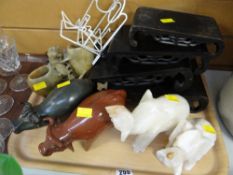 Collection of carved and pottery animals together with stands