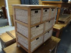 A modern lightwood seven drawer storage unit