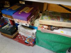 Three tubs of various boxed jigsaw puzzles together with two boxed Sculpture puzzles