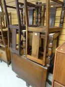 A vintage polished drop leaf dining table and four chairs