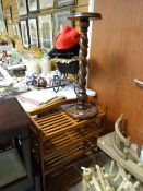 A barley-twist planter stand and an open bookcase