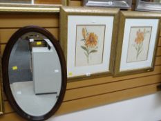 Two modern gilt framed prints of lilies together with a vintage mahogany framed oval bevelled wall