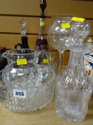 Three decanters, an etched ruby glass and two others, fruit bowl, jug etc