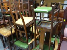 A parcel of sundry dining chairs with mainly green leatherette cushioned seats