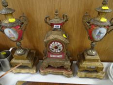 A reproduction Louis XIV-style clock garniture