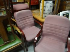 Four dark wood framed and cushioned conference / office-style chairs