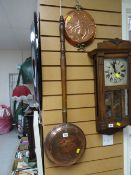 A copper bed warming pan with a copper mould