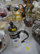 Pair of handled decanters, claret jug and another