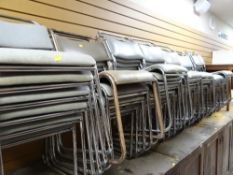 Approximately thirty-six vintage tubular chrome and cushion seated stacking chairs