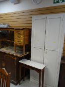 Vintage painted white pine cupboard together with a vintage desk and small table