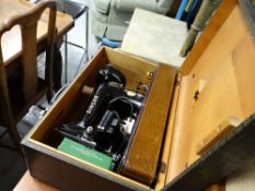 A cased vintage Singer sewing machine