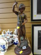 A continental painted spelter figure of a female hay making entitled 'Faneuse'
