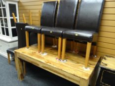 A modern chunky oak dining table together with six high backed brown leather dining chairs