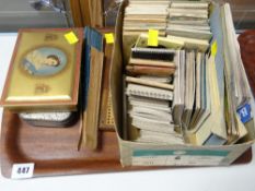 A collection of vintage holiday tourist photographs & guides, coronation tin, cribbage board etc