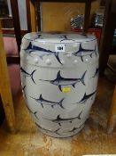 A ceramic barrel seat decorated with swordfish