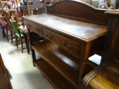 A vintage three tier railback two-drawer chiffonier