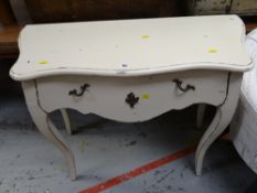 A reproduction Louis XVI-style painted shaped top console table