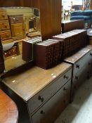 A vintage polished three-drawer dressing table with mirror and a collection of Encyclopedia