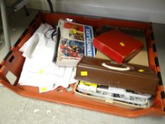 Tray of various items including table linen, binoculars, toolkit etc