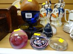 A Bristol blue glass goblet, five various paperweights including Caithness etc