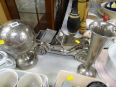 Three decorative brushed steel items, globe, motorcar and vase