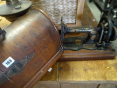 A vintage cased Singer sewing machine