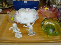 Two Meissen-style cherub figures, green glass bowl on gilt stand etc