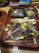 A tray of various flatware, muffin knives, bottle coaster etc