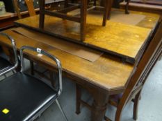 A good vintage light oak extending dining table on castors