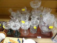 A tray of various drinking glasses and bowls