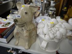 Ornamental ceramic bulldog together with a ceramic white bowl of fruit
