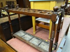 A vintage oak umbrella stand