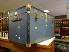 A modern brass effect and studded steamer trunk
