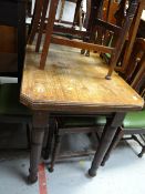 A vintage shaped top table on castor legs