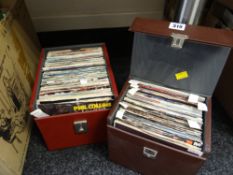 Two cases of single vinyl records from the 70s & 80s