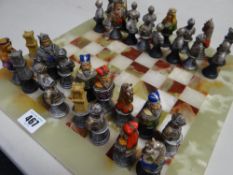 Medieval-style chess set on an onyx board