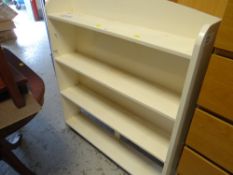 A white painted open bookcase