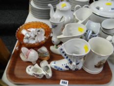 Tray of various collectables including carnival glass fruit bowl, miniature ceramic bells, ceramic