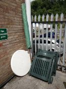 Two green plastic garden loungers, circular garden table and parasol (outside)
