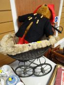 A good vintage child's baby's pram together with a Paddington Bear soft toy