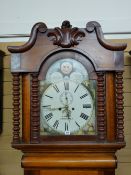 A VICTORIAN MAHOGANY LONGCASE CLOCK by S Bibby, Carnarvon, the painted arched dial set with Roman