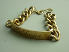 A NINE CARAT GOLD IDENTIFICATION BRACELET inscribed 'G Foster' with large links and safety chain, 50