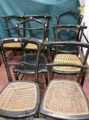 A PARCEL OF SEVEN CIRCA 1900 EBONIZED PARLOUR CHAIRS, four matching and one other with cane work