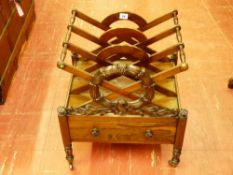 A 19th CENTURY ROSEWOOD CANTERBURY with lower drawer, the 'X' frame dividers with laurel leaf carved