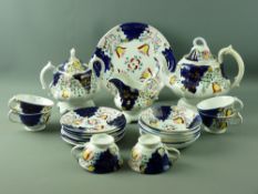 A TWENTY TWO PIECE GAUDY WELSH 'TULIP' TEASET, six cups, six saucers, six side plates, one