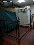 A VICTORIAN BRASS & IRON THREE QUARTER HALF TESTER BED on black pot castors, the brasswork with