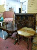 A REPRODUCTION JACOBEAN STYLE BUFFET SIDEBOARD with linenfold and other carved decoration having